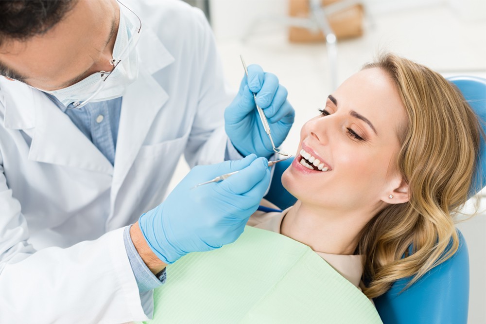 Reasons to visit your dentist regularly